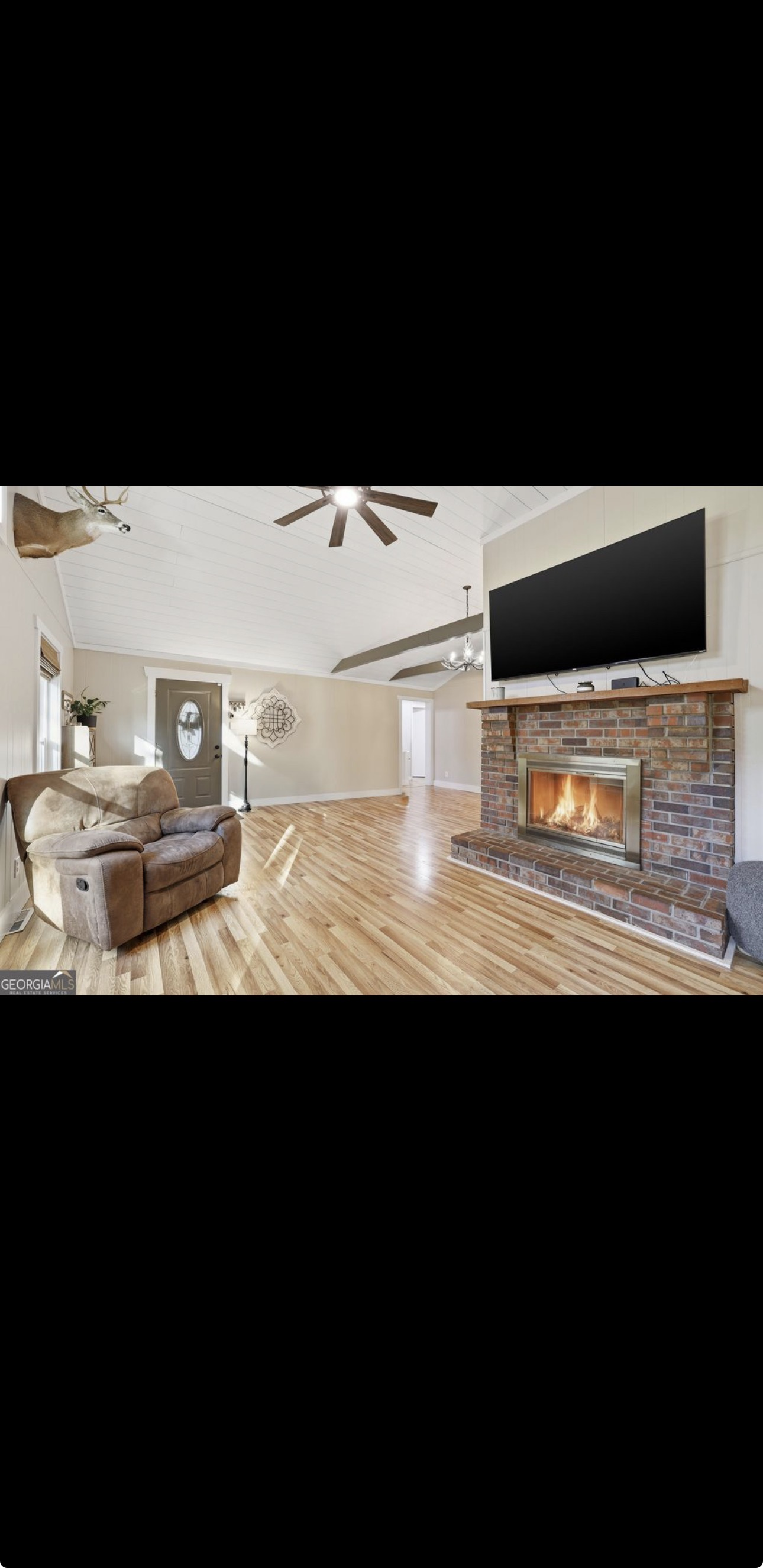 Cozy living room with fireplace and TV mount
